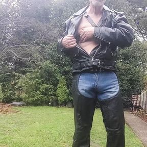 Leather dad enjoying a cigar