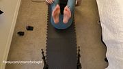 Doing yoga stretches freeballing in leggings