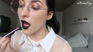 Putting on black lipstick for your pleasure by Domino Faye