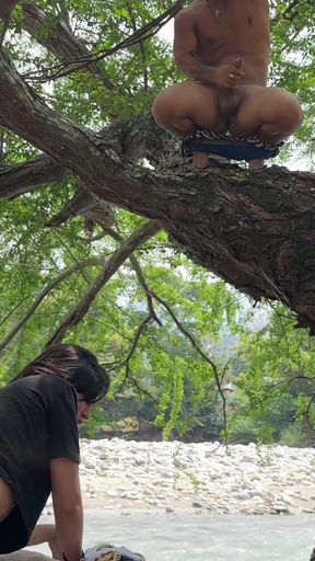 The dwarf in the tree jerks off like crazy until he cums watching the sexy couple fuck on the riverbank in the OPEN AIR   Clip 1