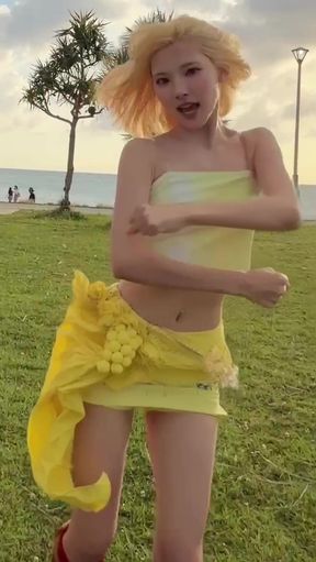 Blonde girl in yellow bikini dancing