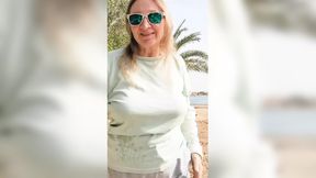Busty GILF dances and strips, showing off hefty natural tits