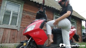 Biker girl masturbates on her red motorcycle