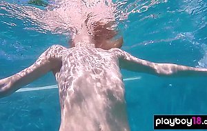 Skinny blonde ukrainian teen Clarise reveals her small tits in the pool