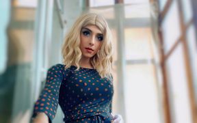 Shemale Twists Her Ass in Front of the Window, Seducing Random Passers-by and Walks in the Entrance Dressed in Women's Clothes