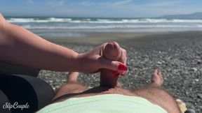 Beach Babe gives sloppy handjobs and blowjobs on the sand