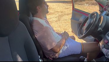 A guy jerking off alone in his car gets a blowjob from a stranger until he cums