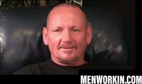 Tattooed mature guy strokes his dick alone