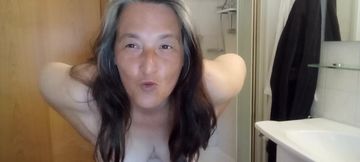 Mature voluptuous woman shows off her wet curves
