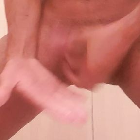 Young young man masturbating until he cums in the bath