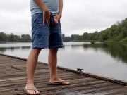 Redbull piss outside at the river, on the dock