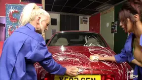 Gorgeous babes washing a car together and masturbating with toys