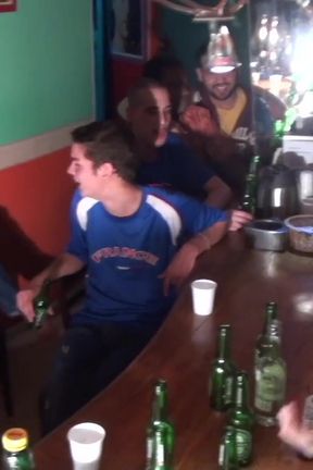 Two footballers with feet and foot humiliation in a  bar
