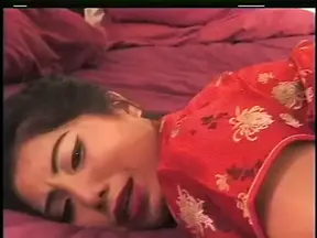 Asian slut has interracial sex with white stud on the bed