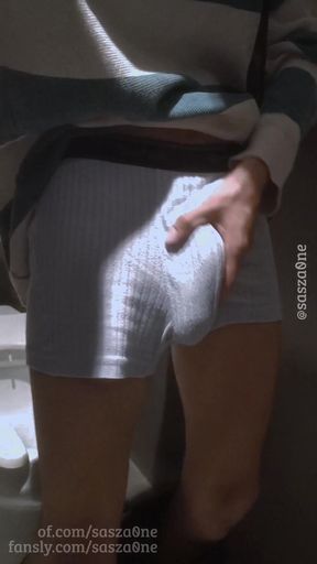 Twink rubbing his huge cock through his boxers in public