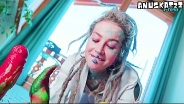 Lingerie-clad tattooed girl stuffs her holes with big dildos