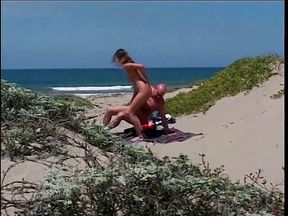 Brunette hottie fucking bald dude on the beach