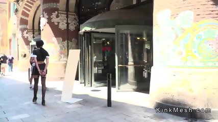 Brazilian slave gags ashtray in public