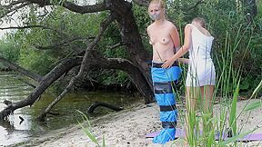 Girl Tied And Gagged In Trashbags On The Beach