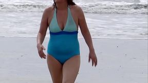 On the beach, my wife shows off, looking for a man to fuck her, strips naked, and urinates