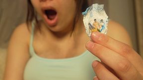 Giantess Girl unwraps a candy but is surprised because there is a tiny man in the candy bag. She is curious to see what it tastes like, so she tries it. It seems that the tiny man really annoys her, so she starts sucking it like a candy.