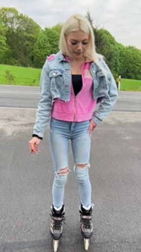 A rollerblade blondie girl is littering and smoking and spitting loogies while smoking a cigarillo