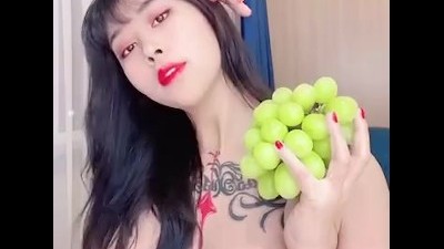 Chinese Girl and her Green Grapes!