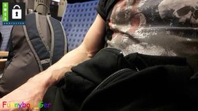 Hot guy jerking in a driving train and cum on his shirt