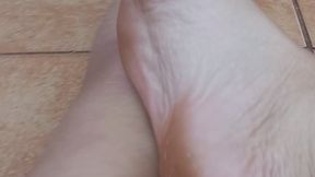 showing small, dirty feet.