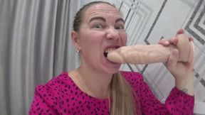 Horny play and biting big dildo with sexy lips