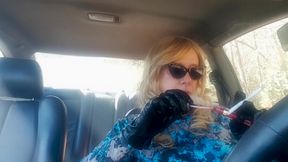 Mature Blonde GILF smoking long cigarettes while driving her car