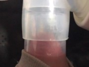 Milking milk with a breast pump to the last drop - close-up - Lactation - Milky tits