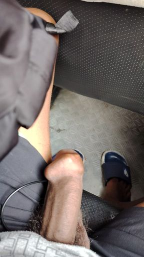 A boy masturbating in a bus while watching outside and passengers