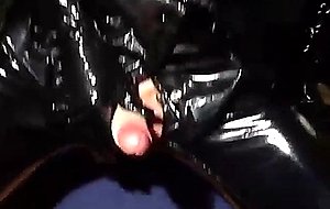 Crossdresser in latex masturbation