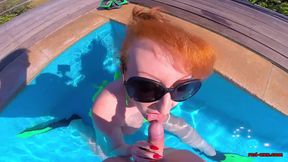 Mature redhead masturbating and sucking in the pool