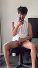 cute asian gay playing in front of the mirror