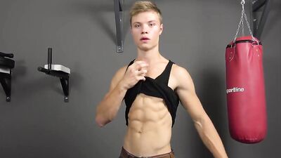 Handsome blonde guy Leo Jonasson is working out on the camera