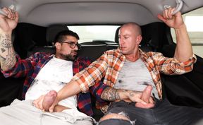 Muscular guys share the backseat for loud jerk off and heavy sex