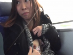 Asian peeing on train