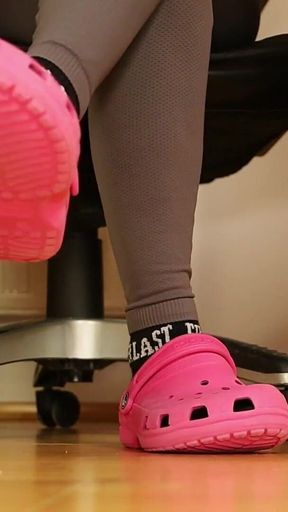 Under Desk Foot Play - Pink Clogs & Worn Socks