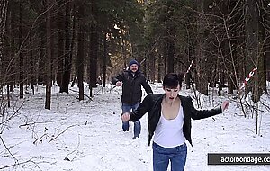 Barefoot Claudia is captured in the cold winter forest