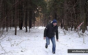 Barefoot Claudia is captured in the cold winter forest