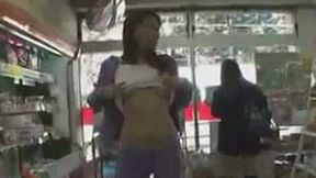 Asian cute sweetheart in the supermarket flashes her tits