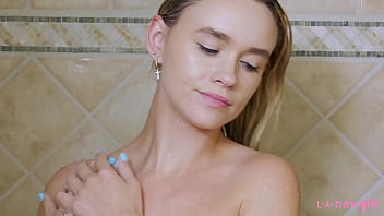 Cute blonde takes sexy shower