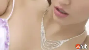 Elegant woman licking my foot while giving me handjob
