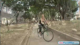 Petite Latina babe flaunts big tits riding bike solo in public park
