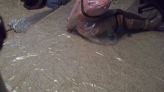 Self-bondage: clear blue raincoat