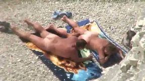Kinky mature sunbathing wife gets her pussy fingered a bit on the beach