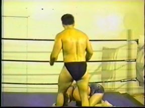 Two fit wrestlers fight naked in a boxing rink