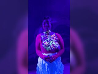 This hottie rides blacklight bazookas, body paint spell cast